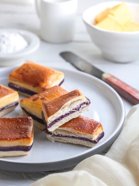 A phone photo of ube cheese pandesal