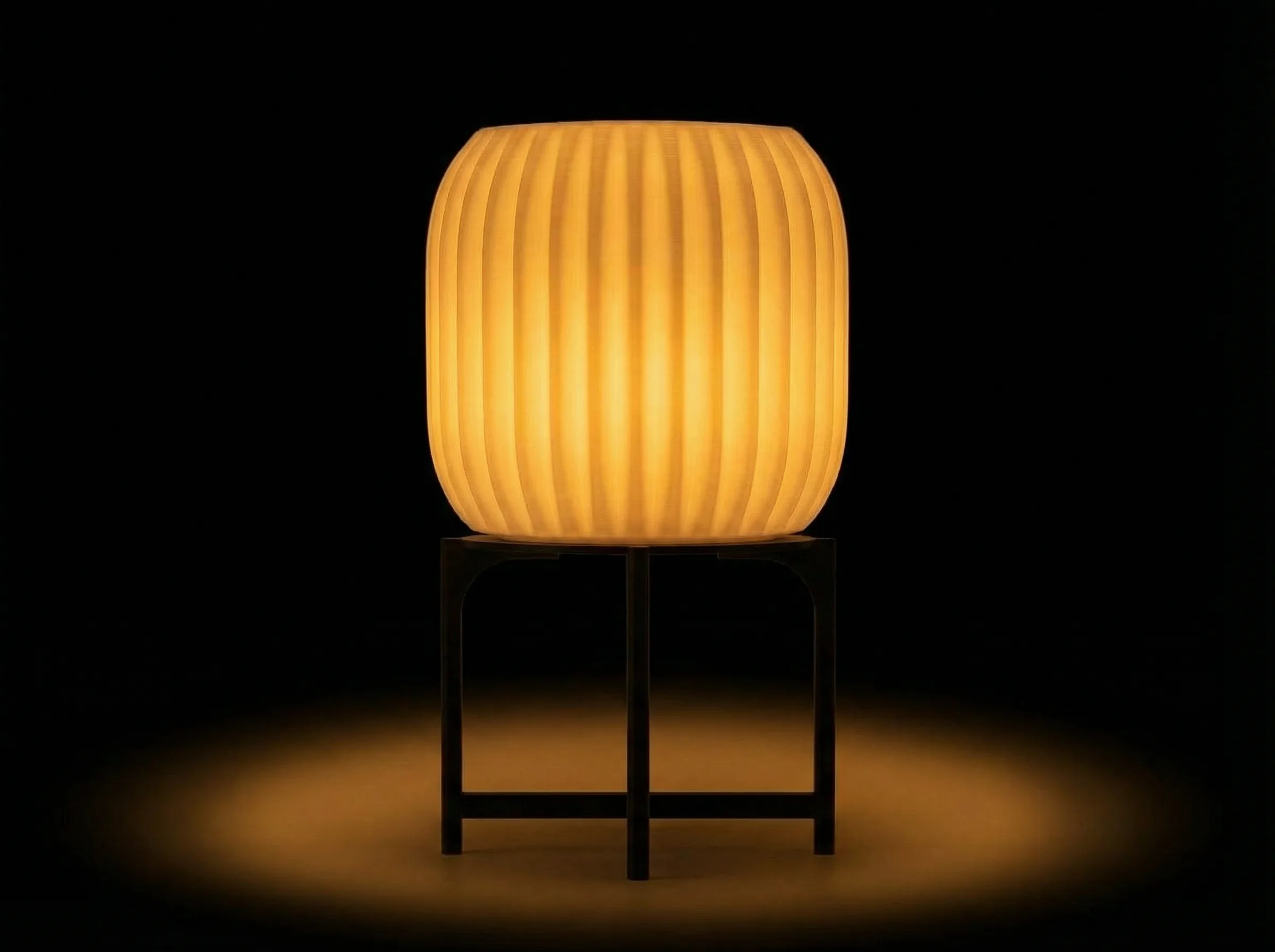 The same lamp lit at night, glowing amber